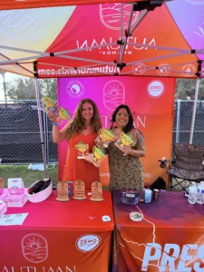 Autumn Brands wins seven awards at Farmer's Cup 420 San Diego, with team members displaying award-winning cannabis flower and preroll trophies at the pesticide-free cannabis brand's booth.